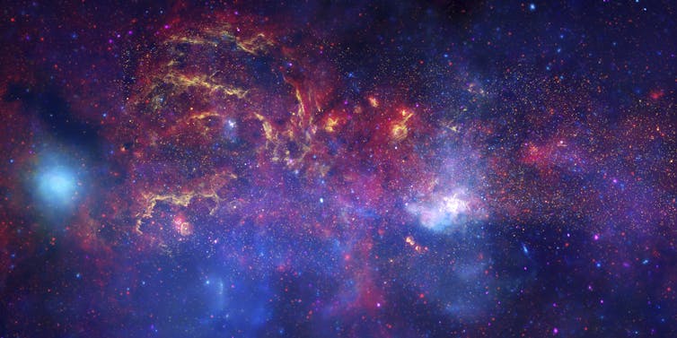 An image of a dense, bulbous, gas- and star-filled region of space.